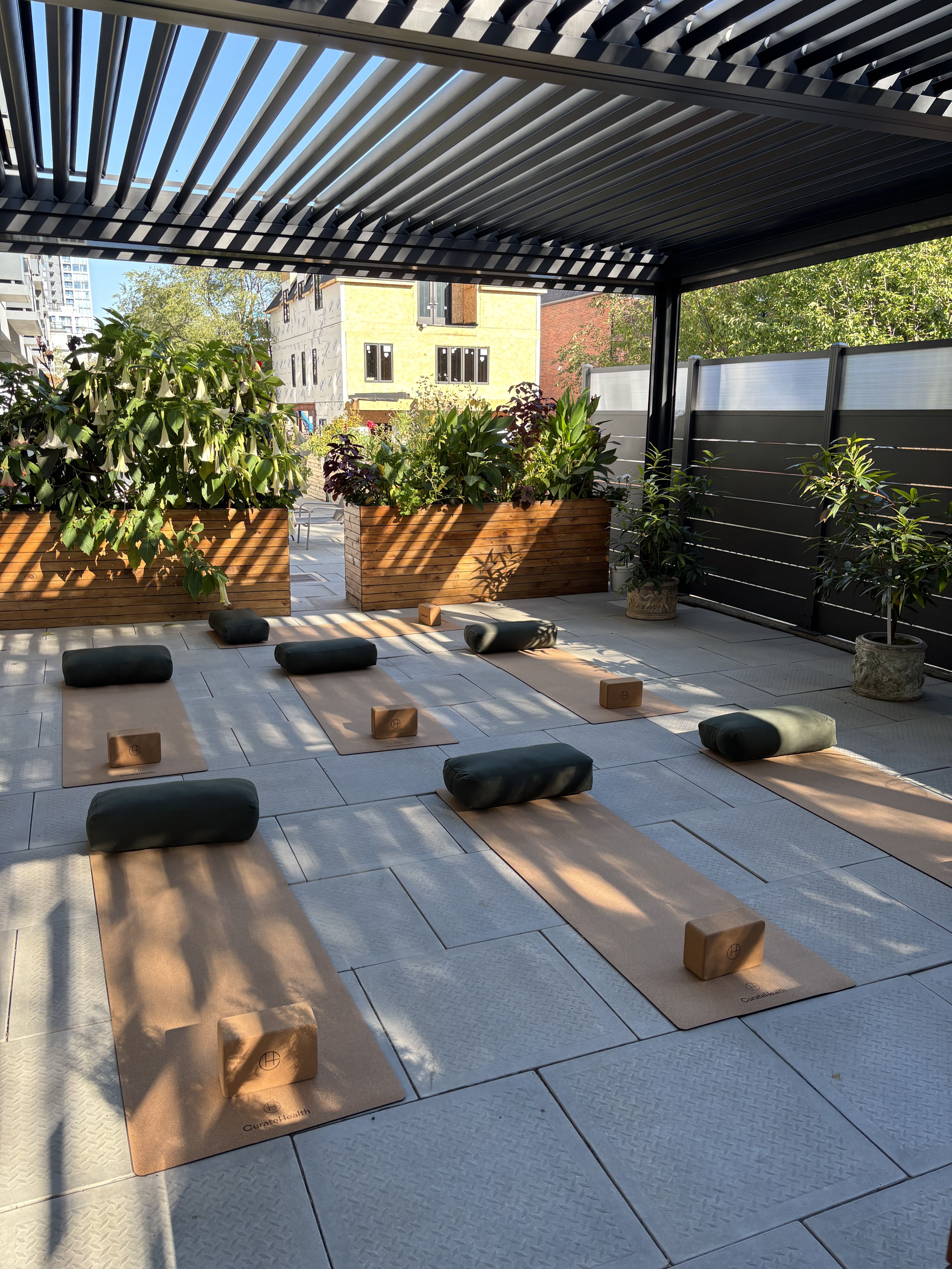Black and white photo of a girl doing a pilates pose in a workout outfit